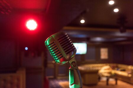 Retro music microphone on stage in a night club. Show or performance conceptの写真素材