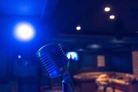 Retro music microphone on stage in a night club. Show or performance conceptの写真素材
