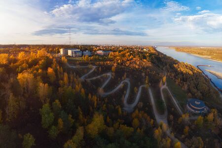 Aerial top vew of winding road in the city, drone shot. Barnaul, Siberia, Russia. Beauty autumn dayの写真素材
