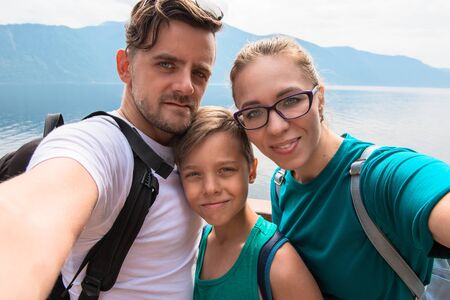 Selfie of family on the Teletskoye lake in Altai mountains, Siberia, Russia. Beauty summer day.の写真素材