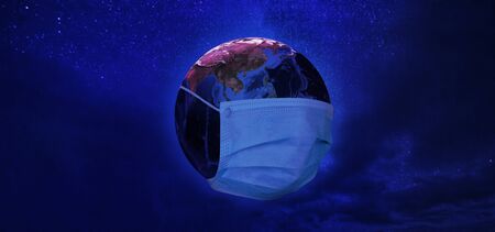 View of Earth from space with medical mask in neon tone.の写真素材