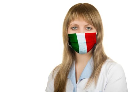 Closeup of a female healthcare professional nurse wearing a protection mask with Italy flagの写真素材