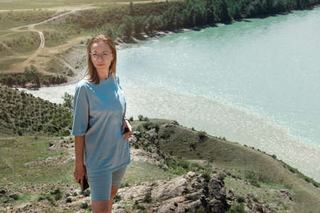 Domestic tourism, travel, lesure and freedom concept after pandemic- woman on the confluence of two...