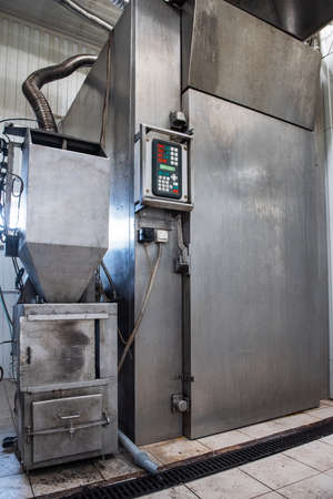 Steel smokehouse with fresh smoked fish.の写真素材