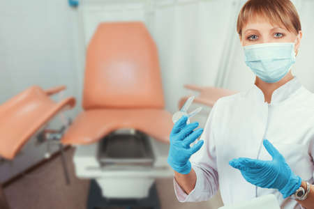 Female gynecologist in protective maskの写真素材
