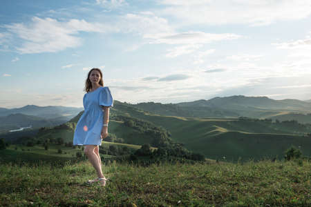 Woman in blue dress in Altai mountain,