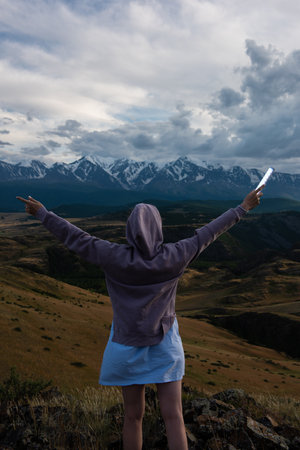Woman in blue dress in summer Altai mountainsの写真素材