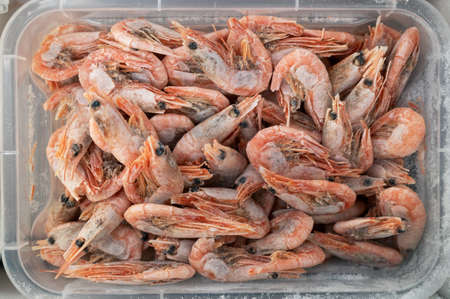 Frozen shrimp in fridge at the fish market.