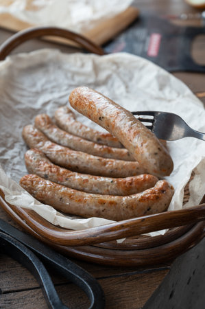 Grilled sausages with sauce and vegetableの写真素材