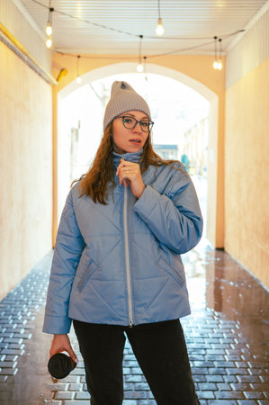 Portrait of a stylish woman in blue jacket. Spring outdoor portrait.の写真素材