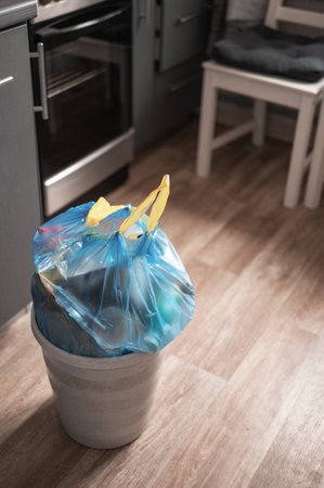 Plastic garbage bag from the trash bin in the apartmentの写真素材