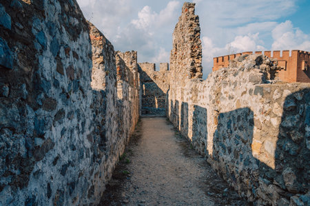 Fortress ruins of the historical Red Tower - Kizil Kule, in Alanya Castle. The Red Tower is the symbol of the Alanya city, and the famous touristic place, Turkey (Turkiye).の写真素材