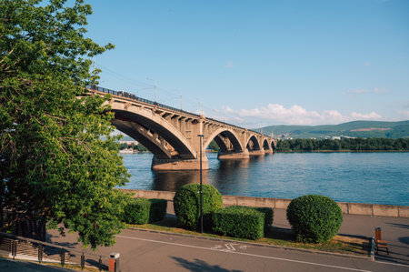 Communal bridge over the Yenisei River at a beautiful sunny summer day in Krasnoyarsk city.の写真素材