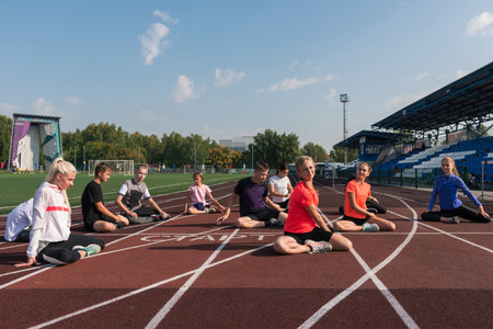 Group of children training at the stadium outdoorsの写真素材