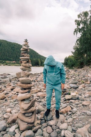 Man at the river Katun at summer day. Trip on Altai Mountains in Altai Republicの写真素材