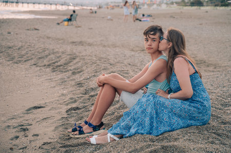 Happy family mom and her teen son on a beach at the sea in Alanya city, Turkey. Travelling or vacation conceptの写真素材