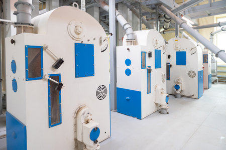 Roller deck machines for husking buckwheat grain, operating in a modern processing facility.の写真素材