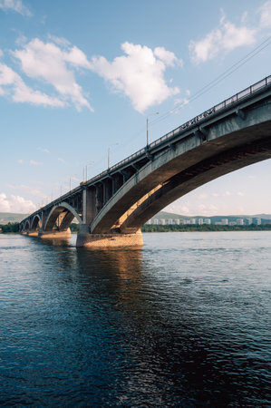 Communal bridge over the Yenisei River at beauty sunny summer day in Krasnoyarsk city.の写真素材