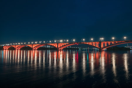 Night view of the Communal bridge in Krasnoyarsk through the Yenisei River in Russia, Krasnoyarsk.の写真素材