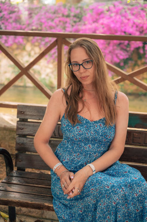 Woman sits on the bench. Travelling or vacation conceptの写真素材