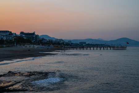 Beautiful sunrise scene on Alanya beach with view to famous Alanya island, in Turkeyの写真素材