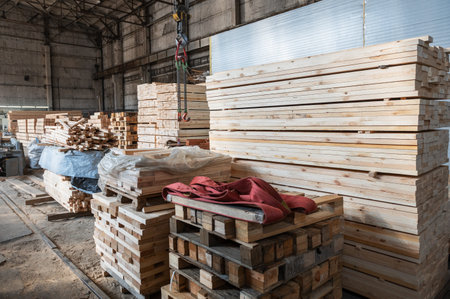 Stacked wooden planks close-up at lumber warehouse. Wood industry conceptの写真素材