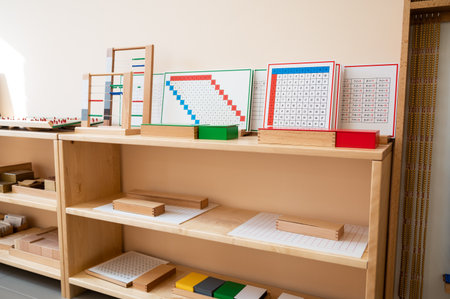 Montessori material. Wooden shelf with materials for Montessori studiesの写真素材