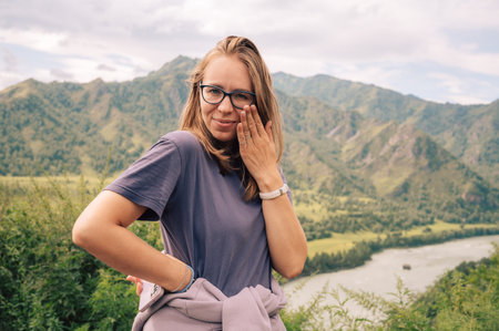 Woman at the river Katun at summer day. Trip on Altai Mountains in Altai Republicの写真素材
