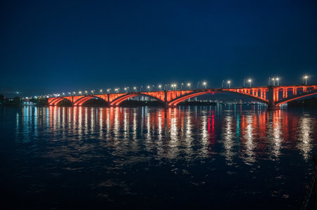 Night view of the Communal bridge in Krasnoyarsk through the Yenisei River in Russia, Krasnoyarsk.の写真素材