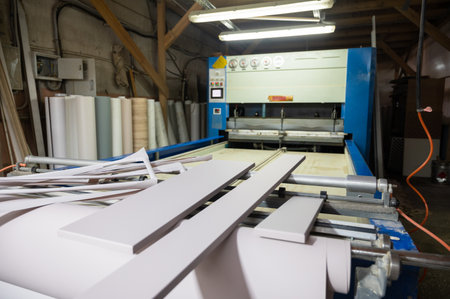 Grinding of wooden furniture panels on a machine. Furniture production conceptの写真素材