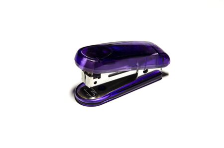 Purple isolated stapler on white background