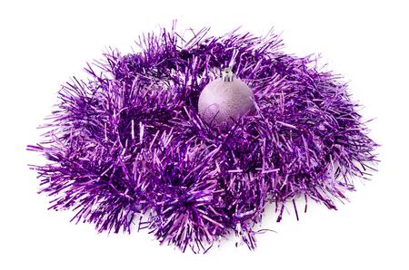 Purple Christmas toy and tinsel isolatedの写真素材
