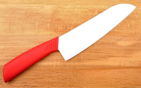 ceramic knife on wooden backgroundの写真素材