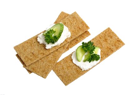 crispbread with curd cheese with cucumber and parsleyの写真素材