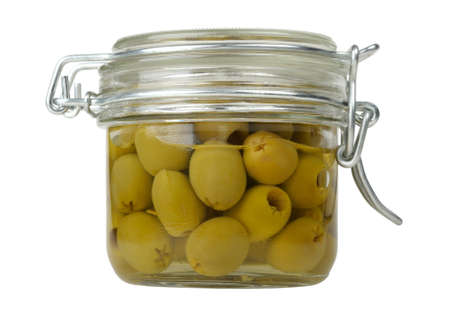 olives in a glass jar isolated on white backgroundの写真素材