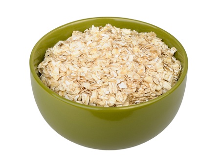 uncooked rolled oats isolated on white backgroundの写真素材