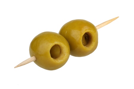 Olives on a toothpick isolated on white backgroundの写真素材