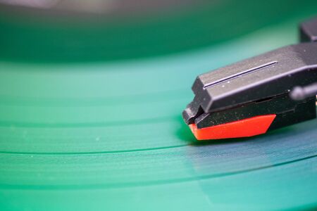 Selective focus of record needle on record