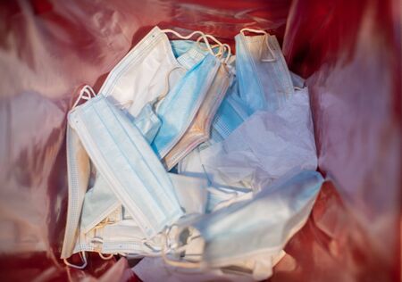 Surgical mask on inside of medical waste box