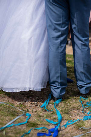Rear view of bride and groom standingの写真素材