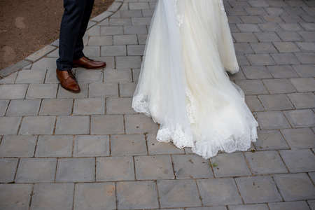 Cropped shot of bride and groom standing outdoorsの写真素材
