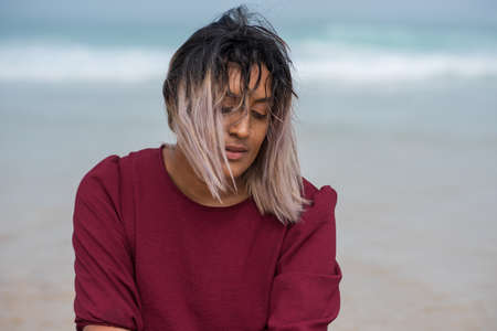 Close up portrait of sad looking womanの写真素材