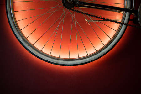 Close up shot of bicycle wheel illuminated