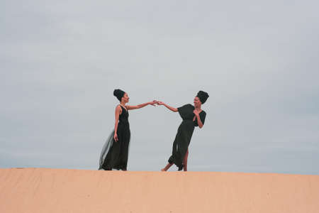 Two woman seen having a playful momentの写真素材