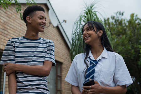 Portrait of two friends having a moment of laughterの写真素材