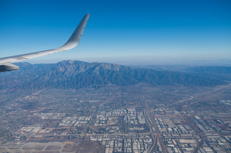 Airplane wing seen flying over Los Angelesの写真素材