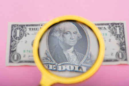Close up shot of dollar not seen through glassの写真素材