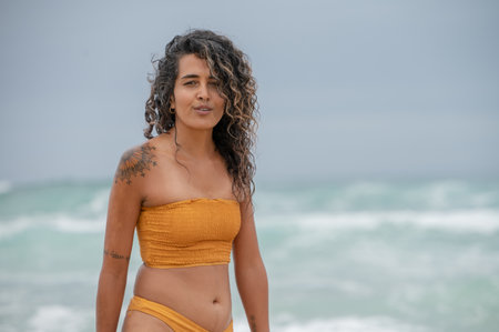 Portrait of beautiful woman with curly hairの写真素材