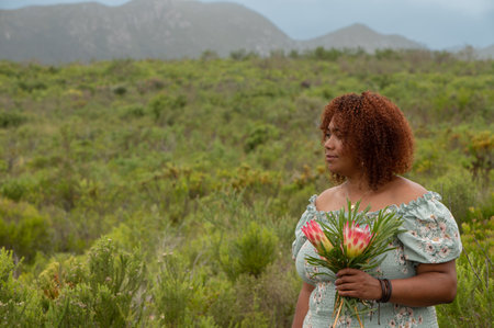 Portrait of woman standing in natureの写真素材
