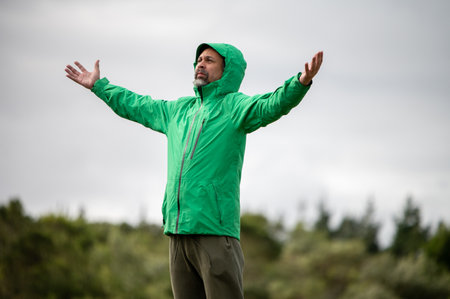 Portrait of man with hands stretched out